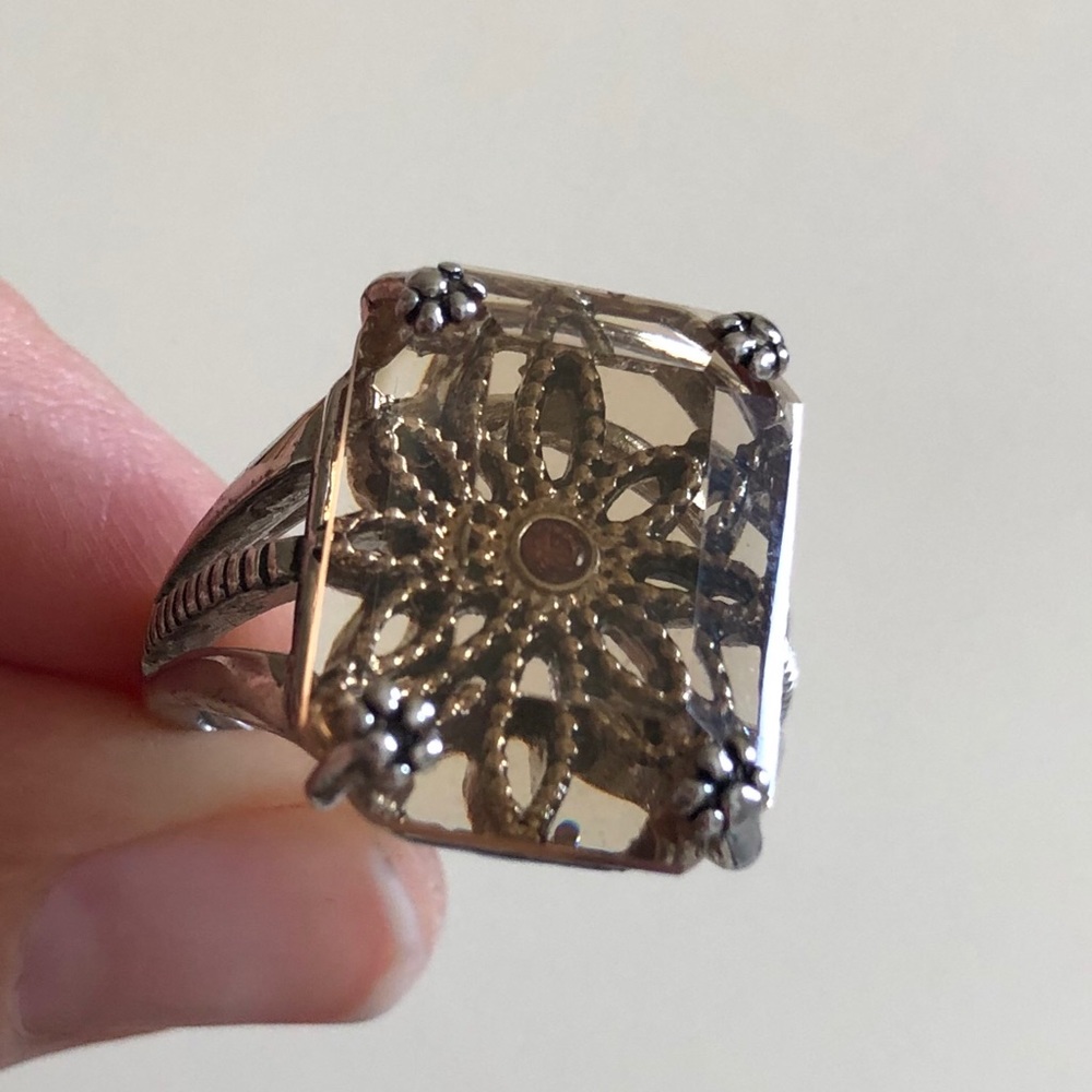 Amber colored ring with flower design. Size 8 Avon